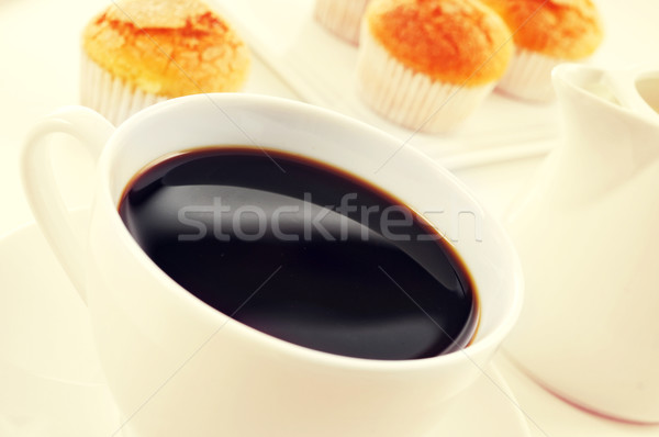 coffee and magdalenas, typical spanish plain muffins, filtered Stock photo © nito