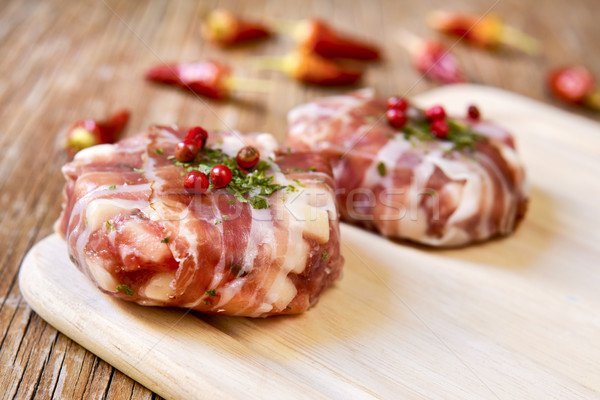 raw homemade burgers covered with bacon strips Stock photo © nito