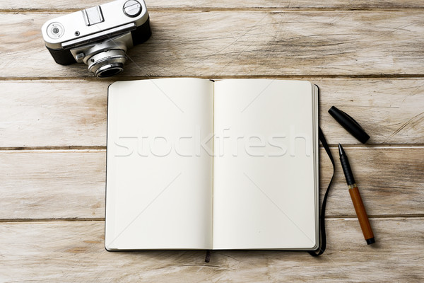 blank notebook, pen and old camera Stock photo © nito