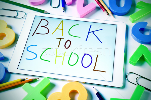 sentence back to school handwritten in a tablet, slight vignette Stock photo © nito