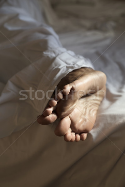 young man lying down on bed  Stock photo © nito