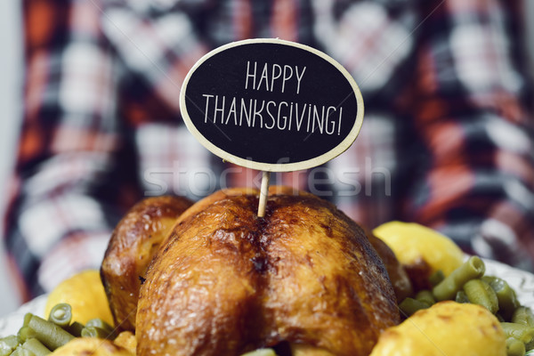 Stock photo: man with roast turkey and text happy thanksgiving