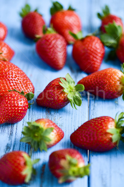 Stock photo: strawberries on a blue wooden surface