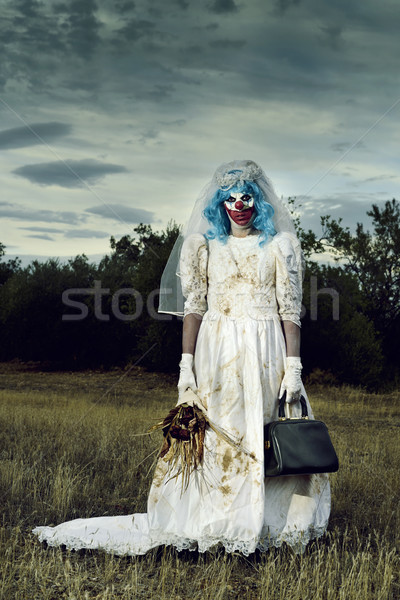 scary evil clown in a bride dress outdoors Stock photo © nito