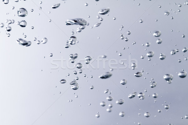 Air bubbles in the water Stock photo © Nneirda