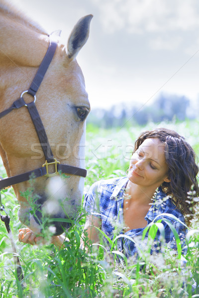 Woman and horse together at paddock Stock photo © Novic