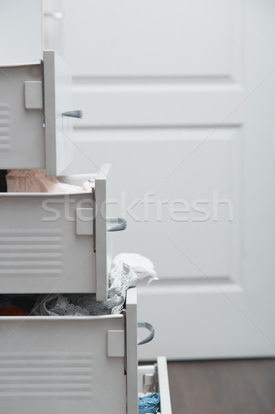 Messy clothes in wardrobe Stock photo © Novic