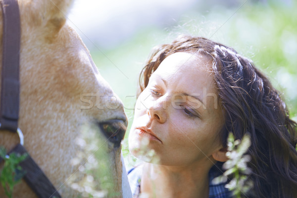 Woman and horse together at paddock Stock photo © Novic