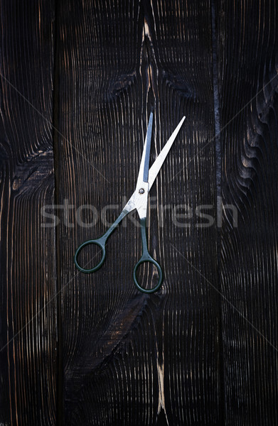 Scissors on a wooden background Stock photo © Novic