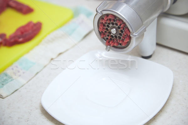 Stock photo: Mincing machine with forse meat
