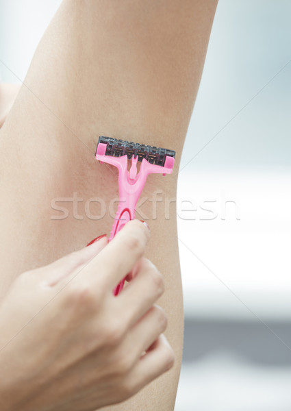 Woman shaving armpit Stock photo © Novic