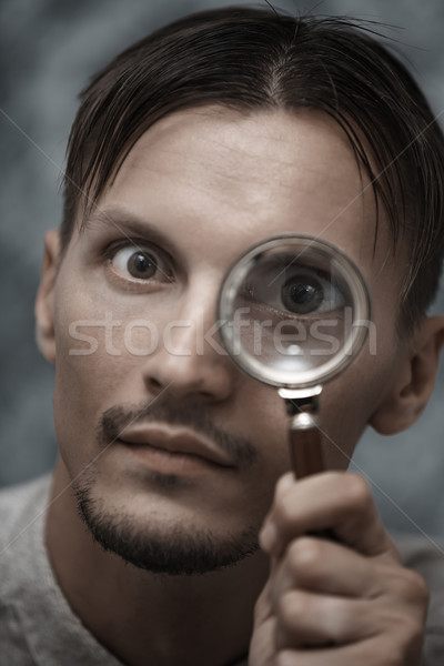 Homem lupa vertical retrato lente idéia Foto stock © Novic