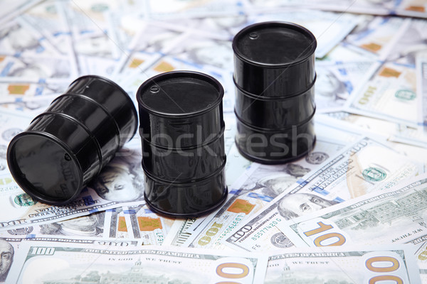 Oil drums on US dollars background Stock photo © Novic
