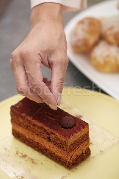 Woman confectioner preparing cake Stock photo © Novic