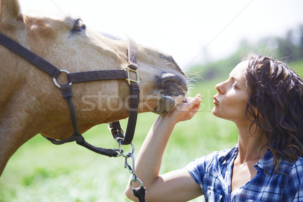 Woman and horse together at paddock Stock photo © Novic