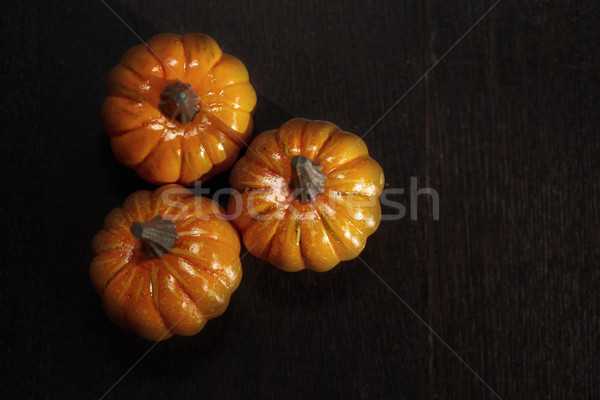 Stock photo: Three pumpkins on a wooden table