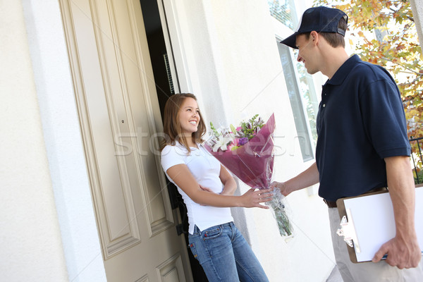 Stock photo: Pretty Woman Receiving Flowers