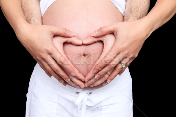 Terhes szeretet terhes nő férfi készít szív Stock fotó © nruboc