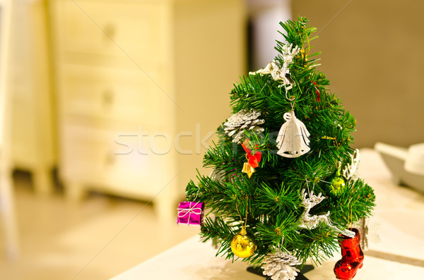 Small decorated Christmas tree on table Stock photo © nuiiko