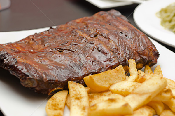 Pork ribs back with french fries Stock photo © nuiiko