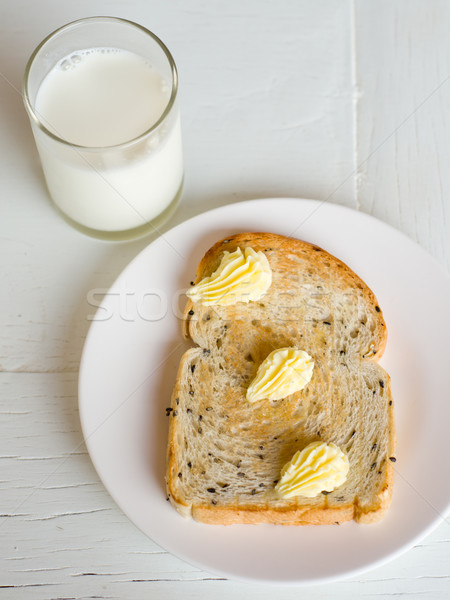 Brood boter witte plaat glas melk Stockfoto © nuttakit