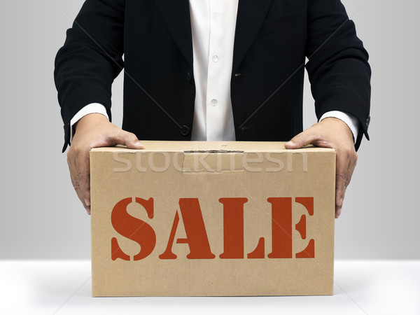 Sprzedaży brązowy papier polu biznesmenów utrzymać w dół Zdjęcia stock © nuttakit