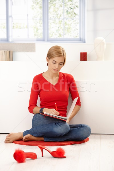 Attractive female wearing red pullover Stock photo © nyul