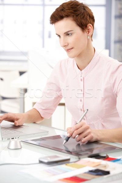 Woman using drawing pad Stock photo © nyul