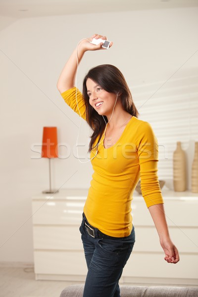 Happy girl dancing with earphones Stock photo © nyul