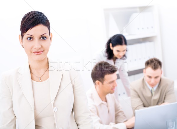 Kobieta interesu stałego front patrząc kamery uśmiechnięty Zdjęcia stock © nyul