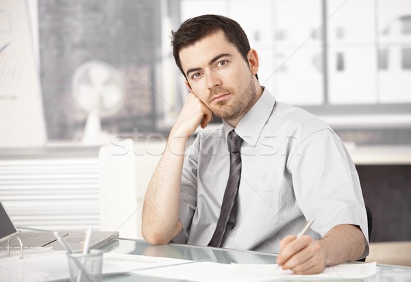 Young Man Working In Office Writing Notes Thinking Stock Photo C Nyul 624605 Stockfresh