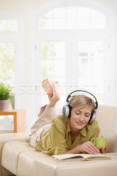 Woman resting on couch at home Stock photo © nyul