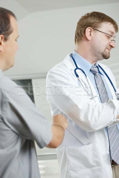 Patient bribing doctor Stock photo © nyul