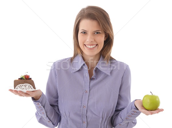 Happy woman offering cake and apple Stock photo © nyul