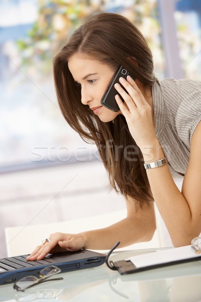 Businesswoman concentrating on work Stock photo © nyul