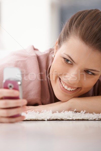 Portrait of happy woman with mobile phone Stock photo © nyul