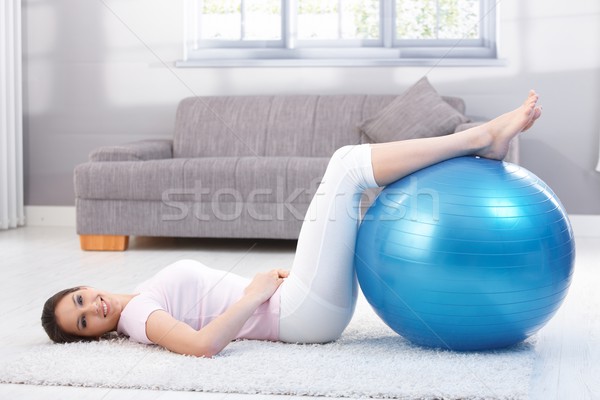 Beautiful woman doing fit ball exercise smiling Stock photo © nyul