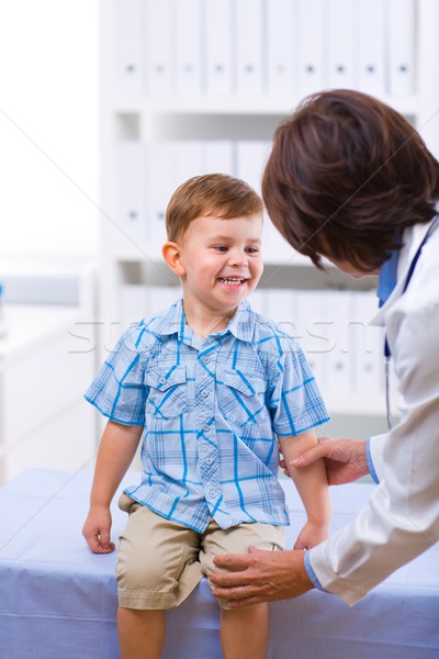 Doctor examining child Stock photo © nyul