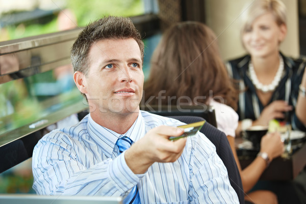 Businessman paying in cafe Stock photo © nyul