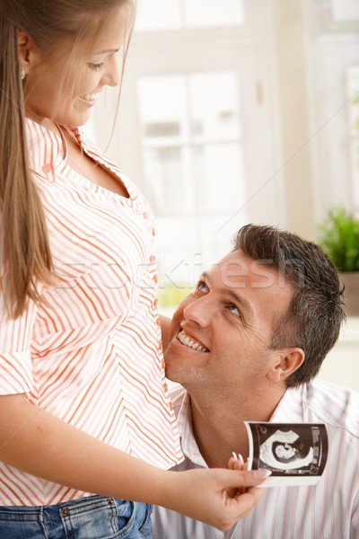 Happy man looking at pregnant woman Stock photo © nyul