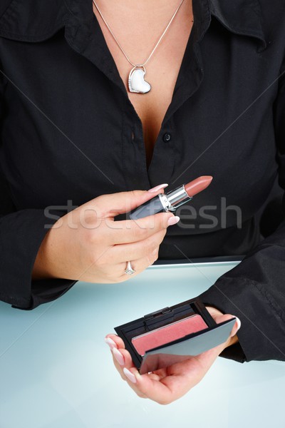 Femenino mano lápiz de labios primer plano mejilla Foto stock © nyul