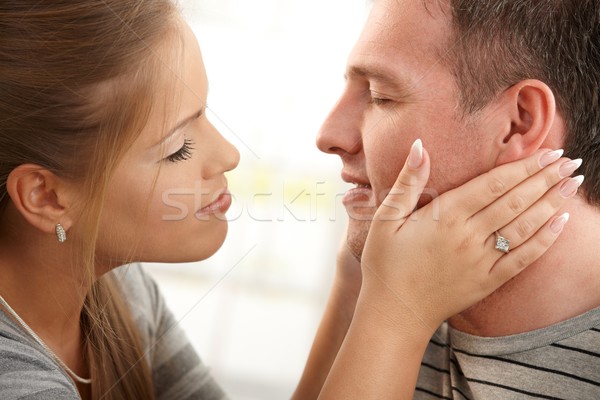 Smiling woman about to kiss man Stock photo © nyul