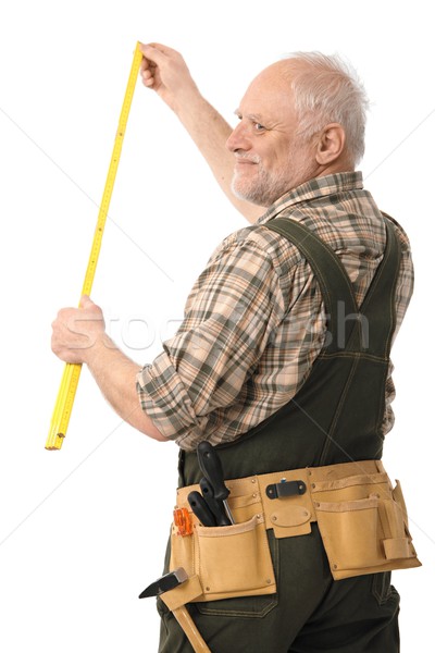 Elderly man measuring Stock photo © nyul
