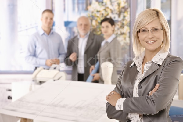 Confident businesswoman with team Stock photo © nyul