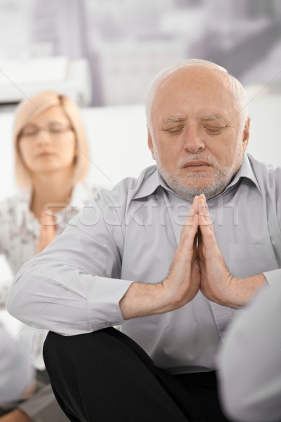 Stock photo: Portrait of meditating businessman