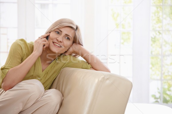 Woman calling at home Stock photo © nyul