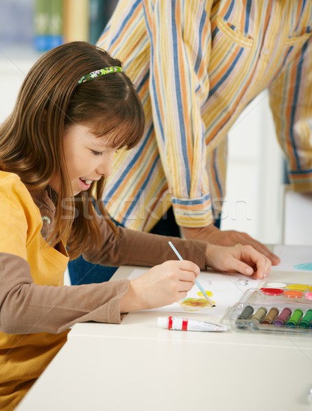 Schoolgirl painting in art class at elementary school Stock photo © nyul