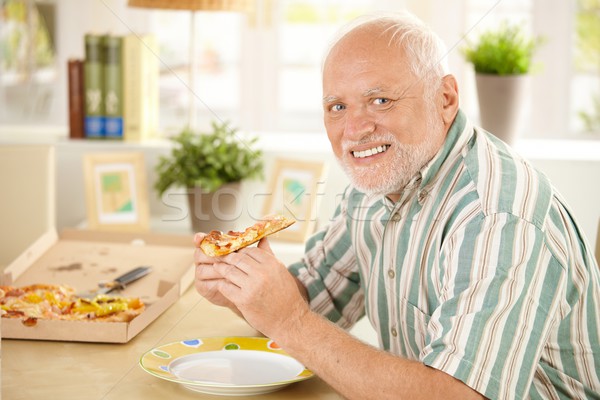 Portret senior pizza man pizza slice home Stockfoto © nyul