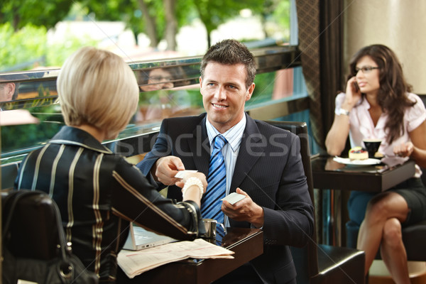 üzleti megbeszélés kávézó fiatal üzletember üzletasszony megbeszélés Stock fotó © nyul