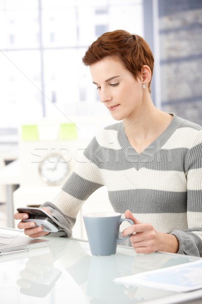 Office worker girl with smartphone Stock photo © nyul